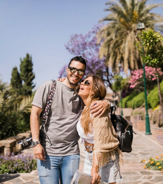 smiling-young-couple-standing-park-min Immigration Services